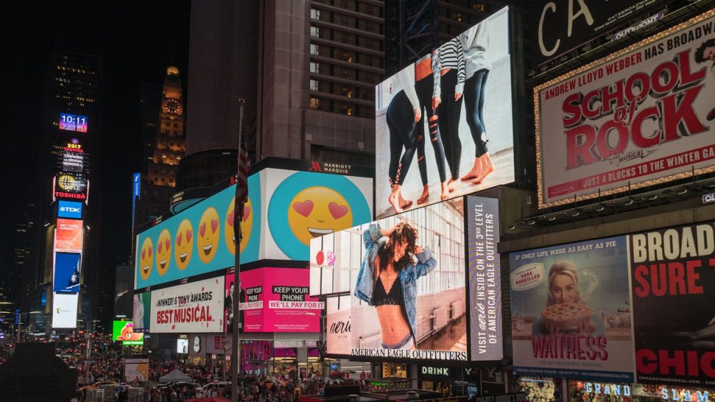 pexels-photo-1058276 Colorful billboards light up New York City's iconic Times Square at night, with vibrant ads and bustling crowds.
