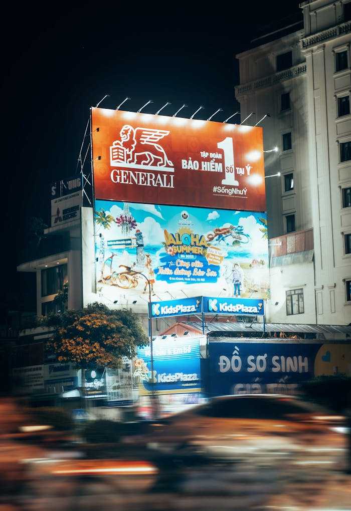 why-choose-us Blurred motion captures a bustling urban street at night with bright billboards.