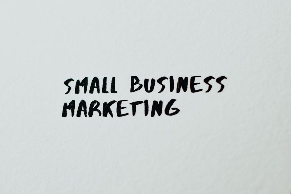 pexels-photo-7661135 Text 'Small Business Marketing' written on white paper for creative use.